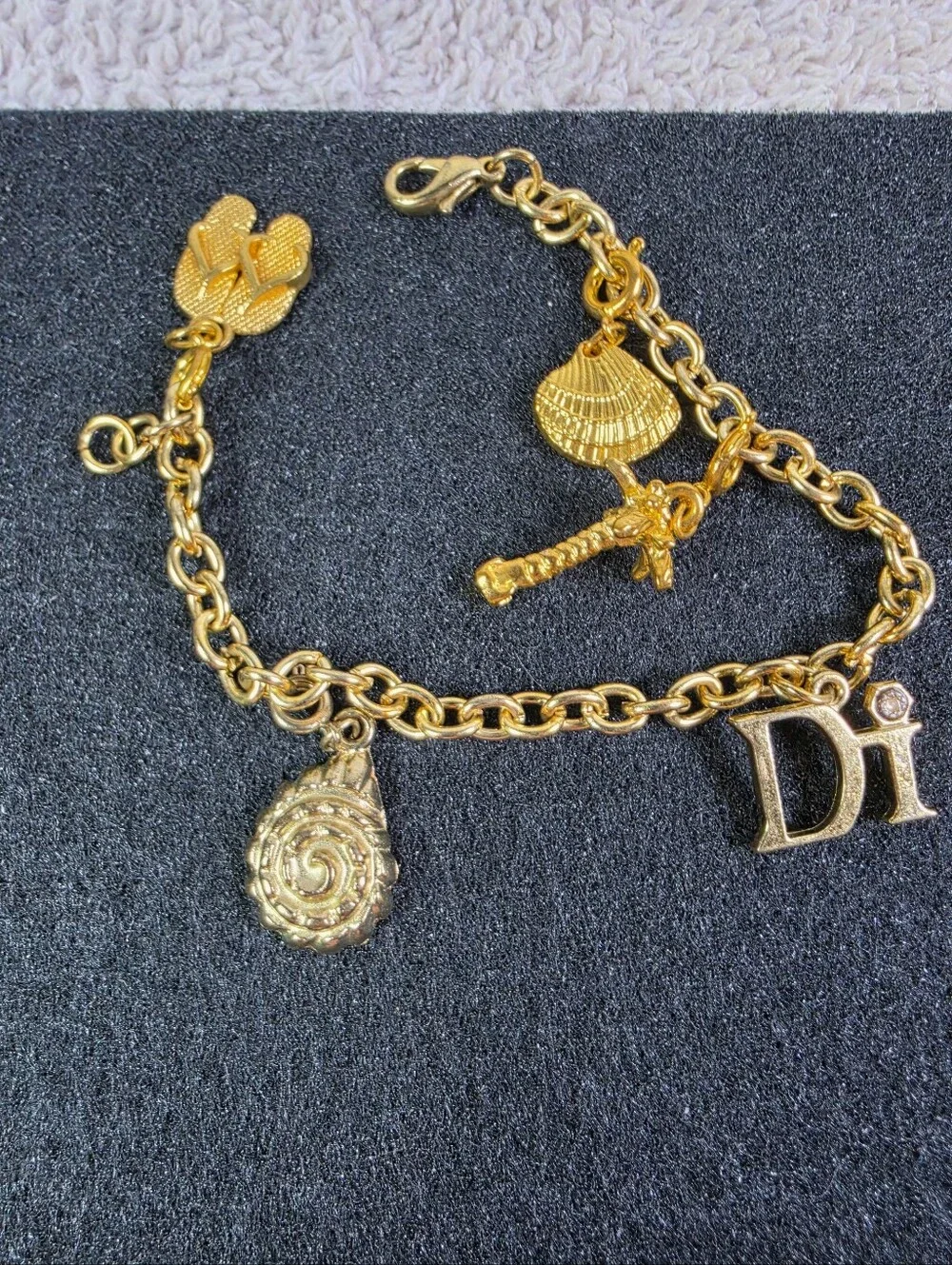 Gold Charm Bracelet with 'Di' Letter and Sea-themed Charms